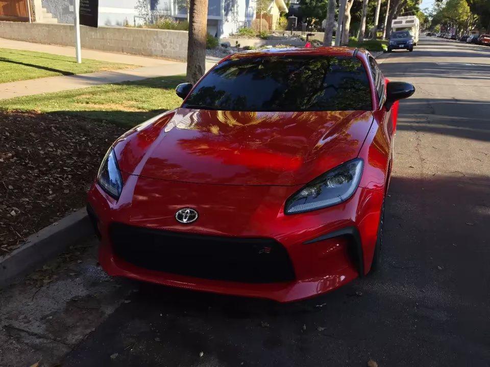 Red Toyota GR86 with tinted front windows